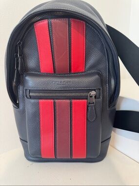 Coach Black Pebbled Leather Sling Backpack with Red Stripe Panels